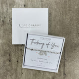 Life Charms the Thoughtful Jewellery Co. Just Because Bracelet Collection; Thinking Of You I've been thinking of you x Pure silver plated dangling butterfly and leaf charms presented on a 5mm beaded stretch bracelet and a branded Life Charm small charm
