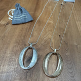 Eliza Gracious quality affordable design led branded costume jewellery
Long snake chain Necklace with a brushed oval pendant. 
Available in Burnished Matt Silver & Pale Gold