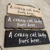 The Giggle Gift Co - Made in the UK
Wooden Hanging Sign L29.5cm
Quote; "Crazy cat lady lives here"