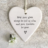 East of India Hanging Porcelain Heart with a fun quote;
'May your glass always be full and your troubles be gone' 4200