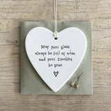 East of India Hanging Porcelain Heart with a fun quote;
'May your glass always be full and your troubles be gone' 4200