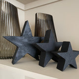 A chunky wooden star made from mango wood. Complete with a black painted finish with visible wood grain. Available in 3 sizes; small 10cm, medium 15cm & large 20cm