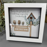 Pebble Art by La De Da Living 
Award winning keepsake gifts - Handmade in the Cotswolds 
Framed Pebble Art - Midi White block square frame 17.5cm
'Birds - Family is like a flock of birds, each member brings a unique melody to our shared sky'