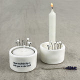 East of India Perfect Gifts with a meaningful quotes;  Small round T-LIght holder 5x5cm with a decorative top with a house & tree   'How wonderful life is with you in the world' 