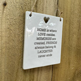 Quotable White Ceramic Hanger 10x12cm with small heart cut out shape
'HOME is where LOVE resides, MEMORIES are created, FRIENDS always belong & LAUGHTER never ends' 