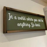 Made in the UK by Giggle Gift Co
Rectangular L63.5cm Framed quotable Plaque in olive green vinyl;
"In a world where you can be anything, Be kind."