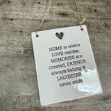 Quotable White Ceramic Hanger 10x12cm with small heart cut out shape
'HOME is where LOVE resides, MEMORIES are created, FRIENDS always belong & LAUGHTER never ends' 