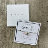 Life Charms the Thoughtful Jewellery Co. Just Because Bracelet Collection; Go For It! World is your oyster x Pure silver plated with cute hanging oyster shell charm that opens to reveal a pearl inside, presented on a 5mm beaded stretch bracelet.