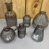 Smokey Grey Small Glass Bottle Vases
Various styles
Leaf pattern H13 x Dia 11cm
Tall Ribbed H19 x Dia 7.5cm
Mini Geometric Bottle H9cm x Dia 5cm
Round Ribbed H8.4 x Dia8.3cm
Small Ribbed H10 x 5cm
Ribbed wide base & narrow top W7.4 x H9.9cm