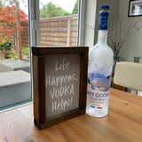 Made in the UK by Giggle Gift co. Small Rectangular H24cm Framed Plaque with Grey vinyl & white text "Life Happens, Vodka Helps!"