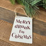 Christmas Mini Metal Hanging Sign 9cm - Off white sign with deep red distorted lettering;
Quote - Merry drunk I'm Chistmas