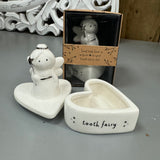 Cute White ceramic Fairy holding a silver wand in a heart shape pot
Quote on the heart pot base 'Tooth Fairy' 
Send with love Gift box 