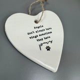 White ceramic hanging heart 10cm with a loving quote;
'Angels don't always have wings, sometimes they have paws'
