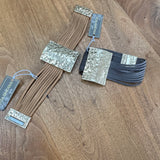 Eliza Gracious quality - affordable design led branded costume jewellery.
Multi stranded suede Bracelet with a beaten pale gold effect magnetic fastener and bar 3.5x5cm detail 
Available in Beige/tan or Dark Grey