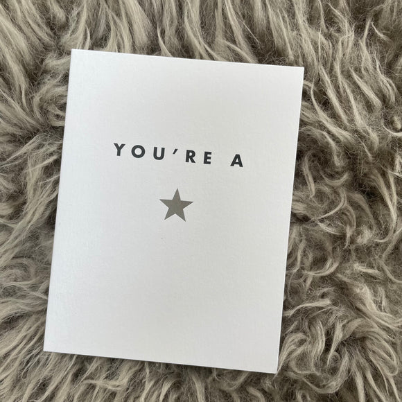 Chalk UK Card Collection - Simple designs but classy     White card 118x90mm, blank inside for your own personal message;  Black text 'YOU'RE A' and a Silver foil star symbol 