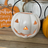 White smiling tlight pumpkin lantern