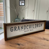 Made in the UK by The Giggle Gift Co.   Long 63.5cm Rectangular Framed Plaque with White vinyl; Grandchildren spoilt here
