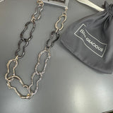 Eliza Gracious quality affordable design led branded costume jewellery
Short mis-shaped chain link Necklace with beaten effect 
Gold mix colour