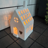Radar - T-light Light House 
White Porcelain with the base for the t-light and house with lots of windows & doors to light it up beautifully when lit. 
Quote in gold text - Home is where the heart is