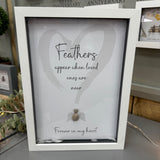 Pebble Art by La De Da Living 
Award winning keepsake gifts - Handmade in the Cotswolds 
Framed Pebble Art - White block frame 31.5cm
'Feathers appear when loved ones are near'
All those special feathers that fall by your feet, collect them inside this frame to make it personal to you