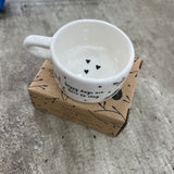 Ceramic T-Light Holder with loving quote: 'Happy days are here to stay' Lovely small gift idea for that special someone to show them you are thinking about them in a simple yet beautiful way. Decorated with branches & hearts all around and a handle at the side.