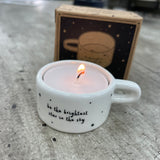 Ceramic T-Light Holder with loving quote: 'Be the brightest star in the sky' Lovely small gift idea for that special someone to show them you are thinking about them in a simple yet beautiful way. Decorated with mini stars all around and a handle at the side.