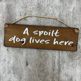Wooden Hanging Sign - "A spoilt dog lives here"
