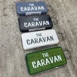 Made in the UK by Giggle Gift Co. Wooden block keyring with white text quote on both sides; 'The Caravan'
