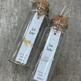 Sweet feather shaped stud earrings presented in a message bottle on a card that reads "soul sister"  Sterling Silver - available in gold or silver