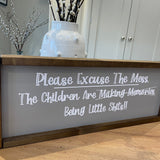 Made in the UK by Giggle Gift Co Rectangular L64cm Framed Plaque with Grey vinyl; "Please Excuse the Mess... the Children are making memories - Being little Shits!!"