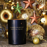 Soy Candle 12.5cm 
Presented in a Black Glass Jar with the Fragrance Winter Wood.
Quote on the candle; 'Celebrate Life each day enjoy it all the way' 