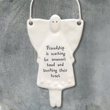 East of India Hanging Porcelain Angel with a meaningful quotes; 'Friendship is reaching for someone's hand and touching their heart' 4059