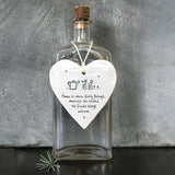 East of India Hanging Porcelain Heart with a meaningful quotes; ' Home is where family belongs, memories are created and friends always welcome