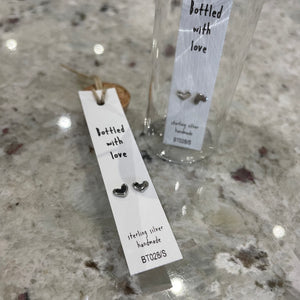 Attic Creations - giftings life's precious moments since 2010;    Message in a Bottle Sterling Silver Earrings handmade in Devon Style - Silver & Gold heart stud earrings Quote on the card - 'Bottled with love'