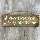 Wooden Hanging Sign - "A rose lives here with an old thorn!"