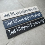 Made in the UK by The Giggle Gift co. Long L59.5cm Wooden Hanging Plaque;  This kitchen is for dancing! LP026