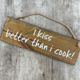 Wooden Hanging Sign - "I kiss better than I cook!"