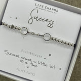 Life Charm Silver Bracelet with chained rings charm - reads "Success #justbecause Success comes a little bit at a time x"