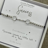 Life Charm Silver Bracelet with chained rings charm - reads "Success #justbecause Success comes a little bit at a time x"