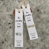 Sweet knot shaped stud earrings presented in a message bottle on a card that reads "our friendship is a knot”  Sterling Silver
