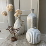 A gorgeous caged antique brown/copper Robin wrapped in 20 warm white LEDs, stood on a round block. Stunning accessory for the home that transforms from day to night, looks great displayed on a shelf or windowsill.