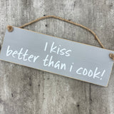 Wooden Hanging Sign - "I kiss better than I cook!"