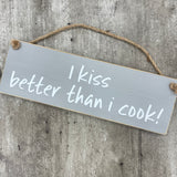 Wooden Hanging Sign - "I kiss better than I cook!"