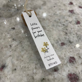 Sweet flower shaped stud earrings presented in a message bottle on a card that reads "little flowers for your birthday"  Sterling Silver