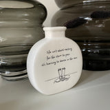 White Ceramic Mini Bud Vase 9cm with quote; 'Life isn’t about waiting for the storm to pass.. it’s learning to dance in the rain'
