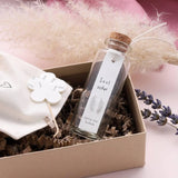 Sweet feather shaped stud earrings presented in a message bottle on a card that reads "soul sister"  Sterling Silver