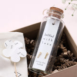Sweet dangly bar shaped earrings with "LOVE" embossed on them. They are beautifully presented in a message bottle on a card that reads "bottled with love"  Sterling Silver