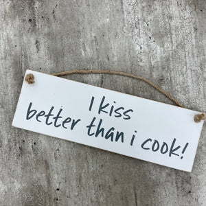 Made in the UK by Giggle Gift Co. Wooden L29.5cm Hanging Sign "I kiss better than I cook!"
