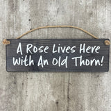 Wooden Hanging Sign - "A rose lives here with an old thorn!"