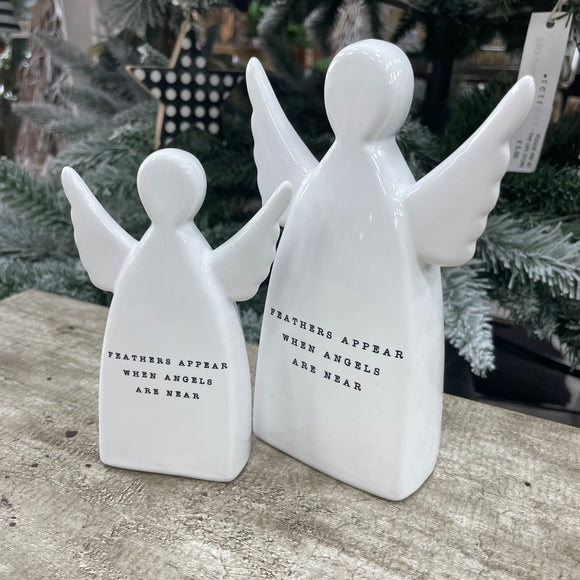 White ceramic standing angel ornament with the sentimental quote: 'Feathers appear when angels are near' Available in 2 sizes; Small 11.5cm and Large 15cm 
